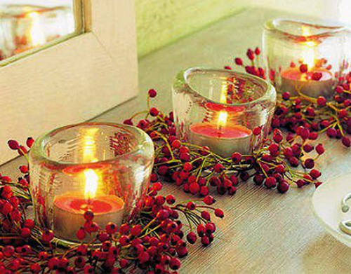 Velas vermelhas com bagas